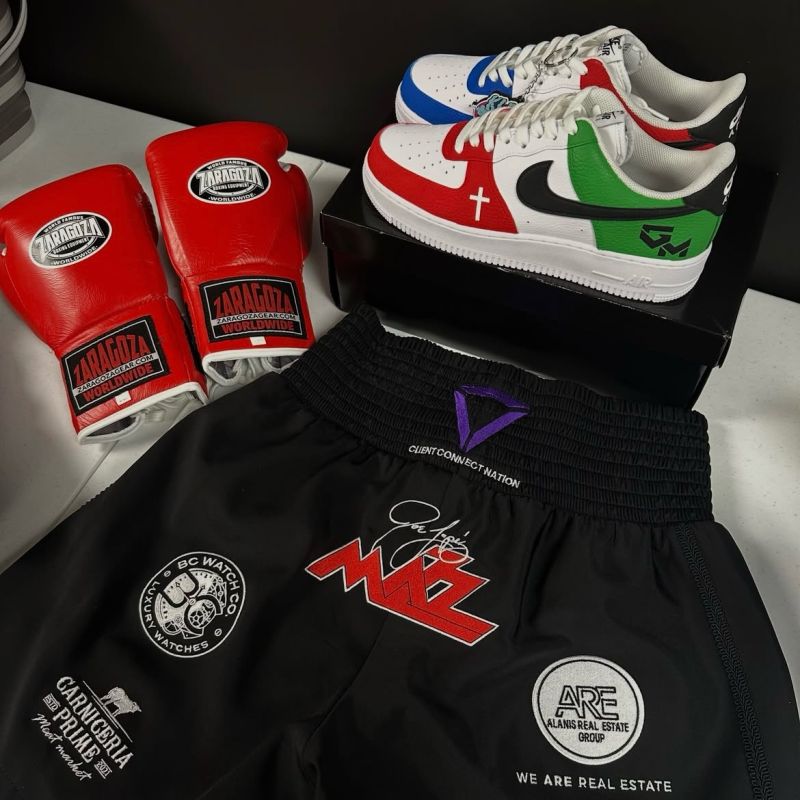 Fight gear with the Client Connect Nation logo on the trunks